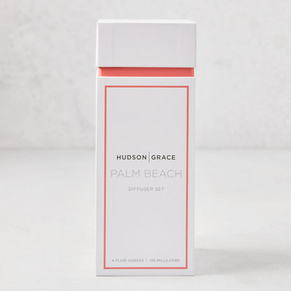 Hudson Grace Palm Beach scented reed diffuser set in a white box with coral trim.