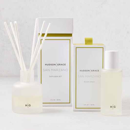 Hudson Grace San Marzano room spray and diffuser gift set with minimalist glass bottles and white boxes.