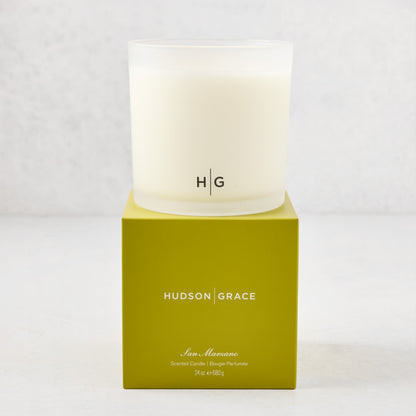 Hudson Grace San Marzano 3-Wick Candle in a frosted glass vessel with HG logo, on a lime green box.