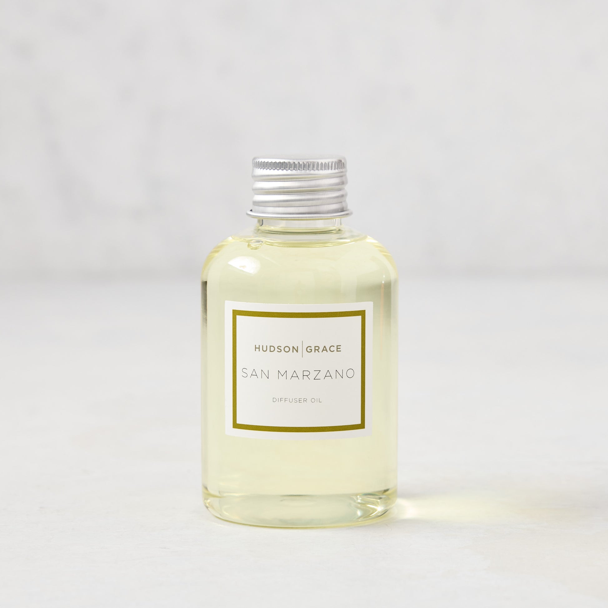 Hudson Grace San Marzano diffuser oil in a clear glass bottle with a silver cap and white label.