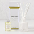 Hudson Grace San Marzano reed diffuser set: frosted glass vessel, white reeds, oil bottle, and white box with gold trim.