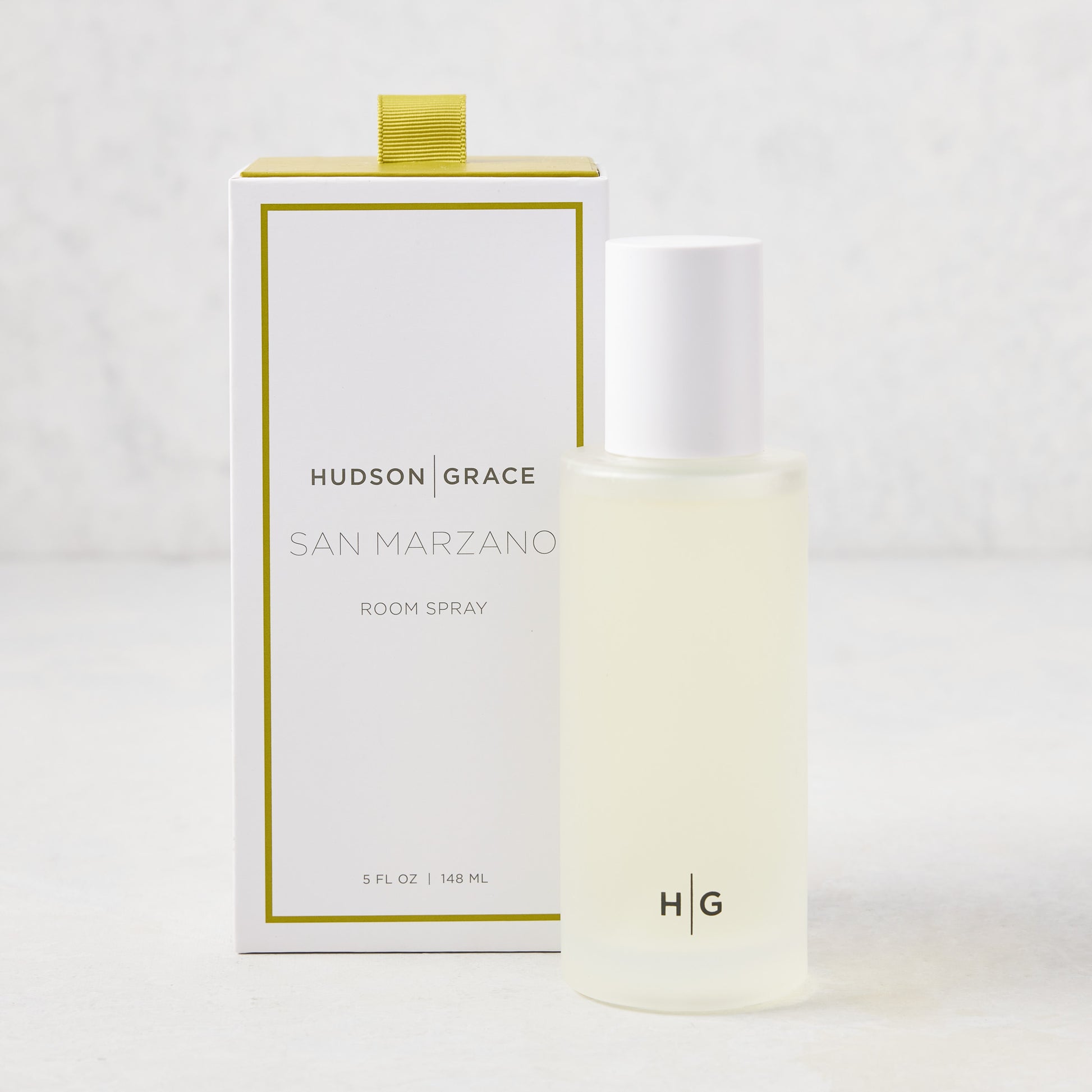 Hudson Grace San Marzano Room Spray: 5.08 oz clear glass bottle with white cap, next to white box with green trim.
