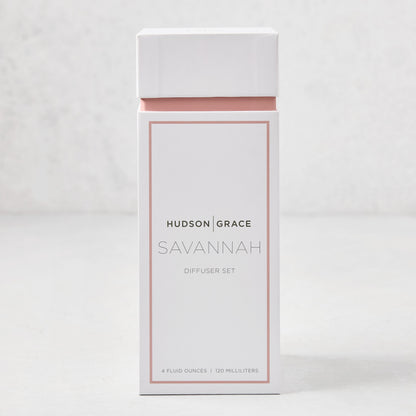 Hudson Grace Savannah scented reed diffuser set in a white and blush pink box.