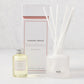 Hudson Grace Savannah Scented Reed Diffuser set with frosted glass vessel, oil bottle, and white reeds.