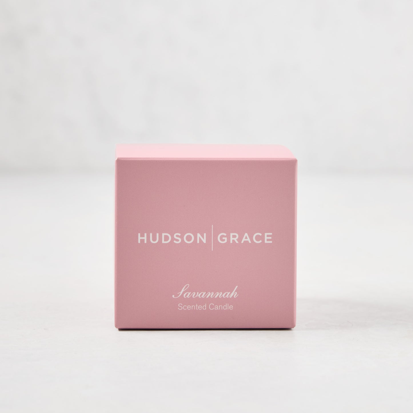 Hudson Grace Savannah Scented Votive Candle in a pink box with white text.