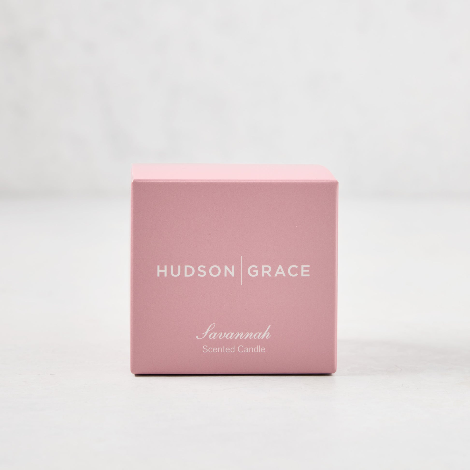 Hudson Grace Savannah Scented Votive Candle in a pink box with white text.