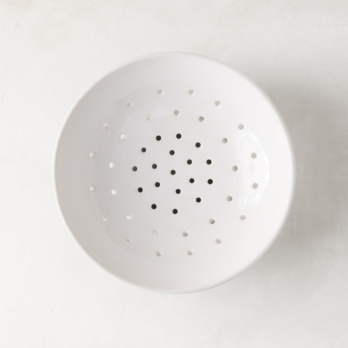 Hudson Grace white ceramic berry bowl, 9"Dia. x 2.5"H, with drainage holes.