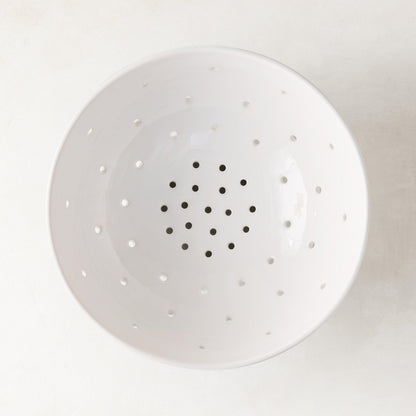 Hudson Grace white ceramic colander, 9.5"Dia, with small drainage holes.