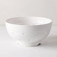 Hudson Grace white ceramic colander, 9.5"Dia x 5"H, with drainage holes and a footed base.