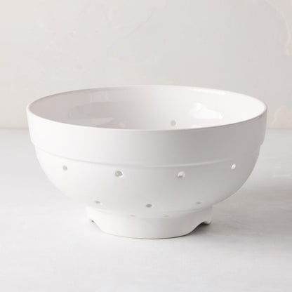 Hudson Grace white ceramic colander, 9.5"Dia x 5"H, with drainage holes and a footed base.