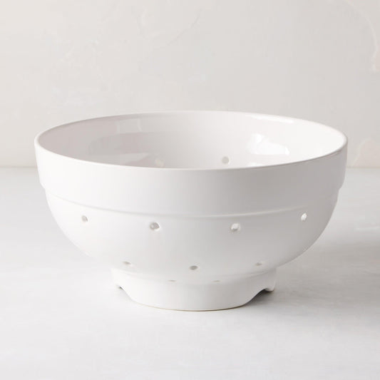 Hudson Grace white ceramic colander, 9.5"Dia x 5"H, with drainage holes and a footed base.