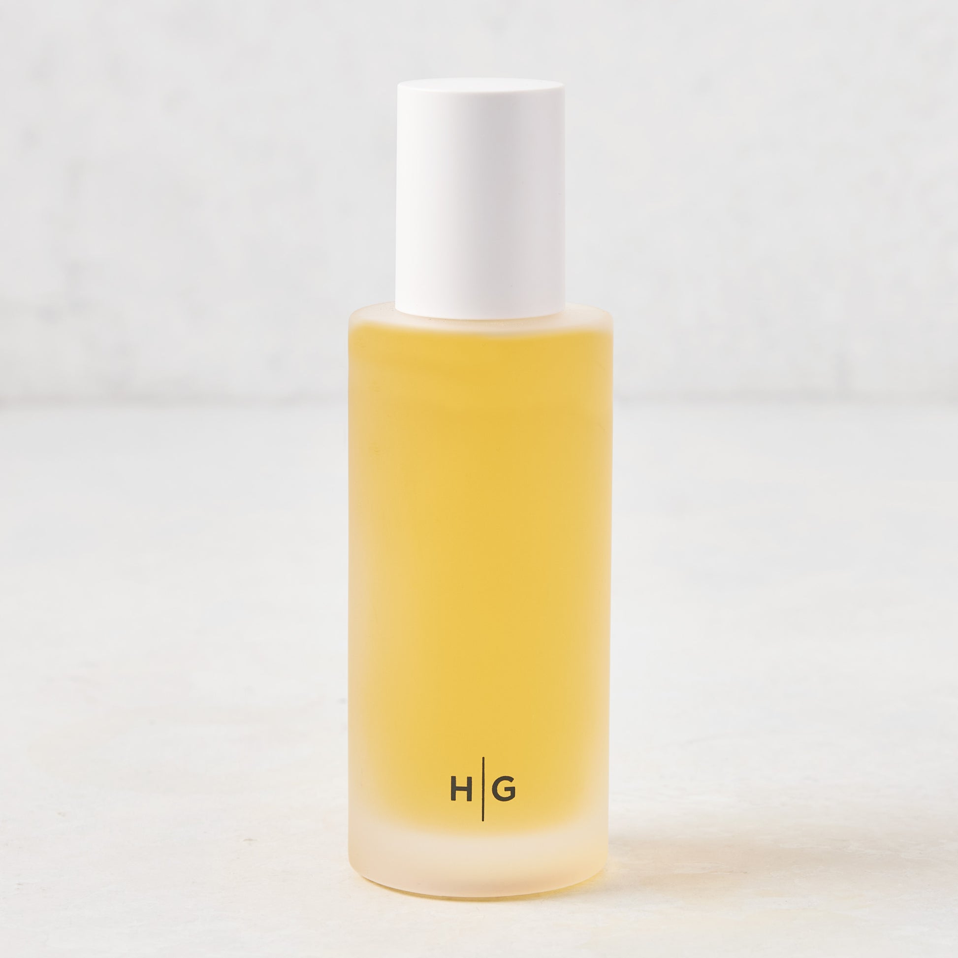 Hudson Grace Winter Scented Room Spray, 5.08 oz frosted glass bottle with white cap and HG logo.