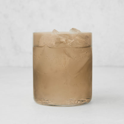 Hugo Chocolate Brown Double Old Fashioned Glass, 3.25"Dia x 4"H, filled with ice and a clear drink.