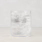 Hugo Clear Double Old Fashioned Glass, 3.25"Dia x 4"H, filled with ice and water, condensation on glass.