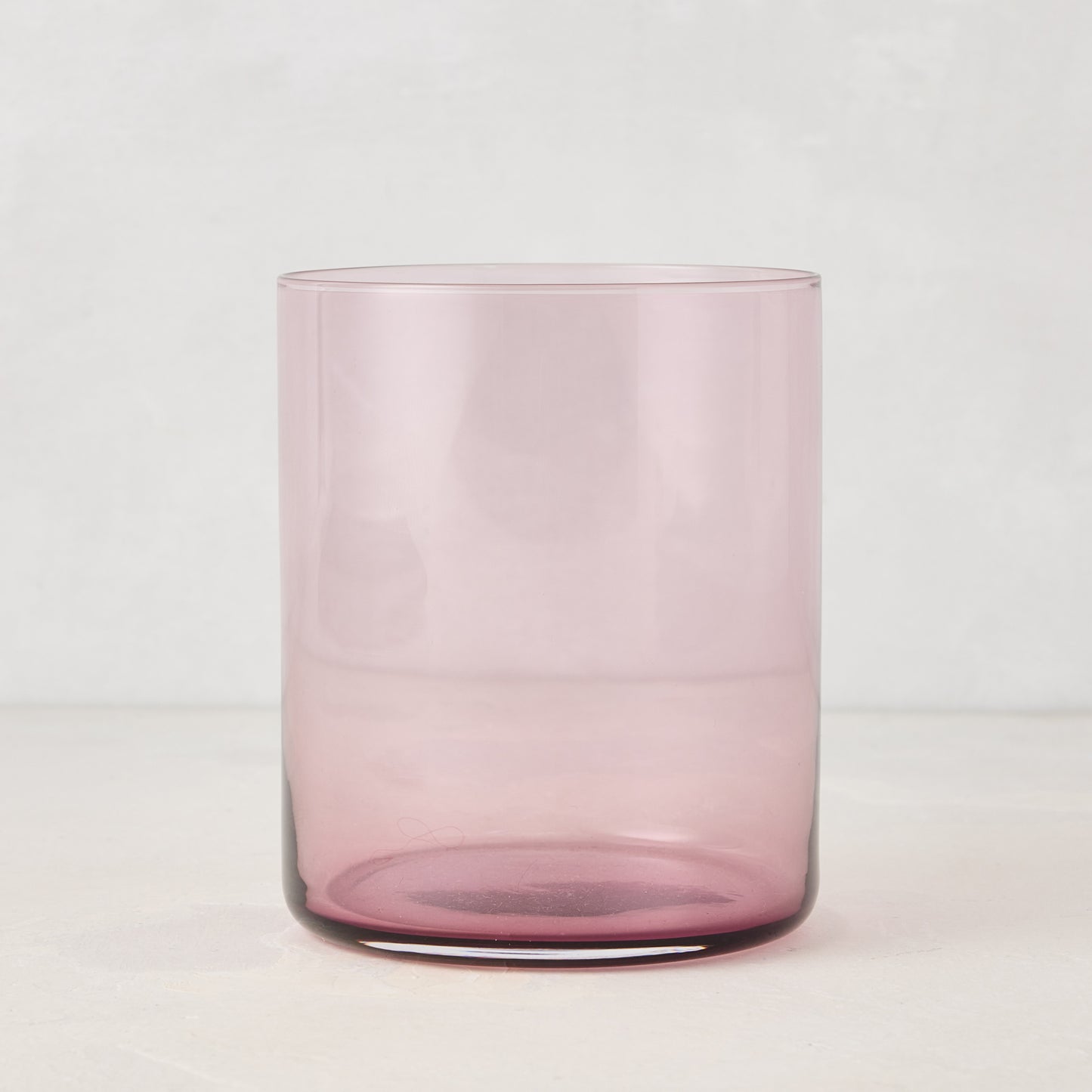 Hugo Fig Double Old Fashioned Glass, a sleek, sturdy, handmade pink glass.
