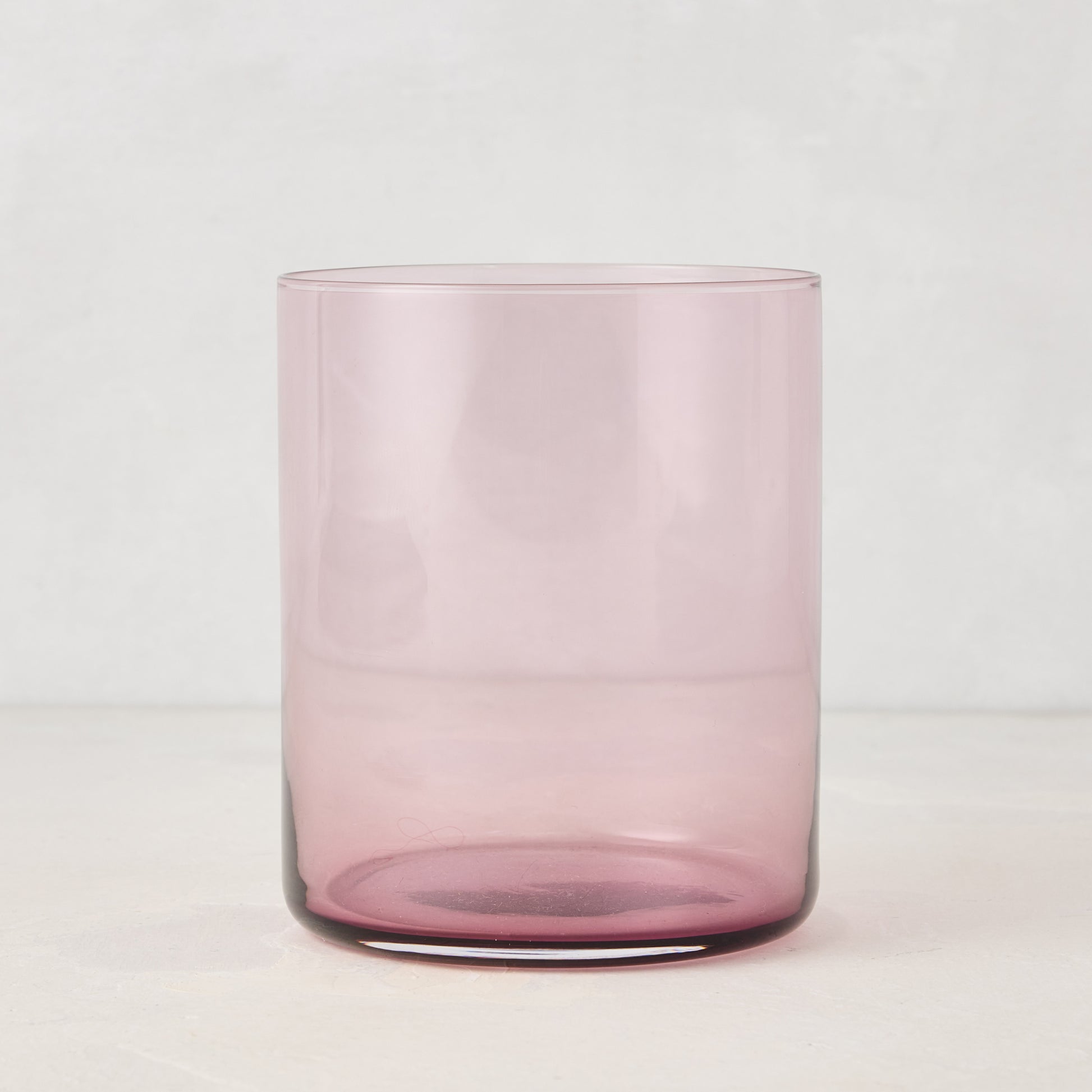 Hugo Fig Double Old Fashioned Glass, a sleek, sturdy, handmade pink glass.