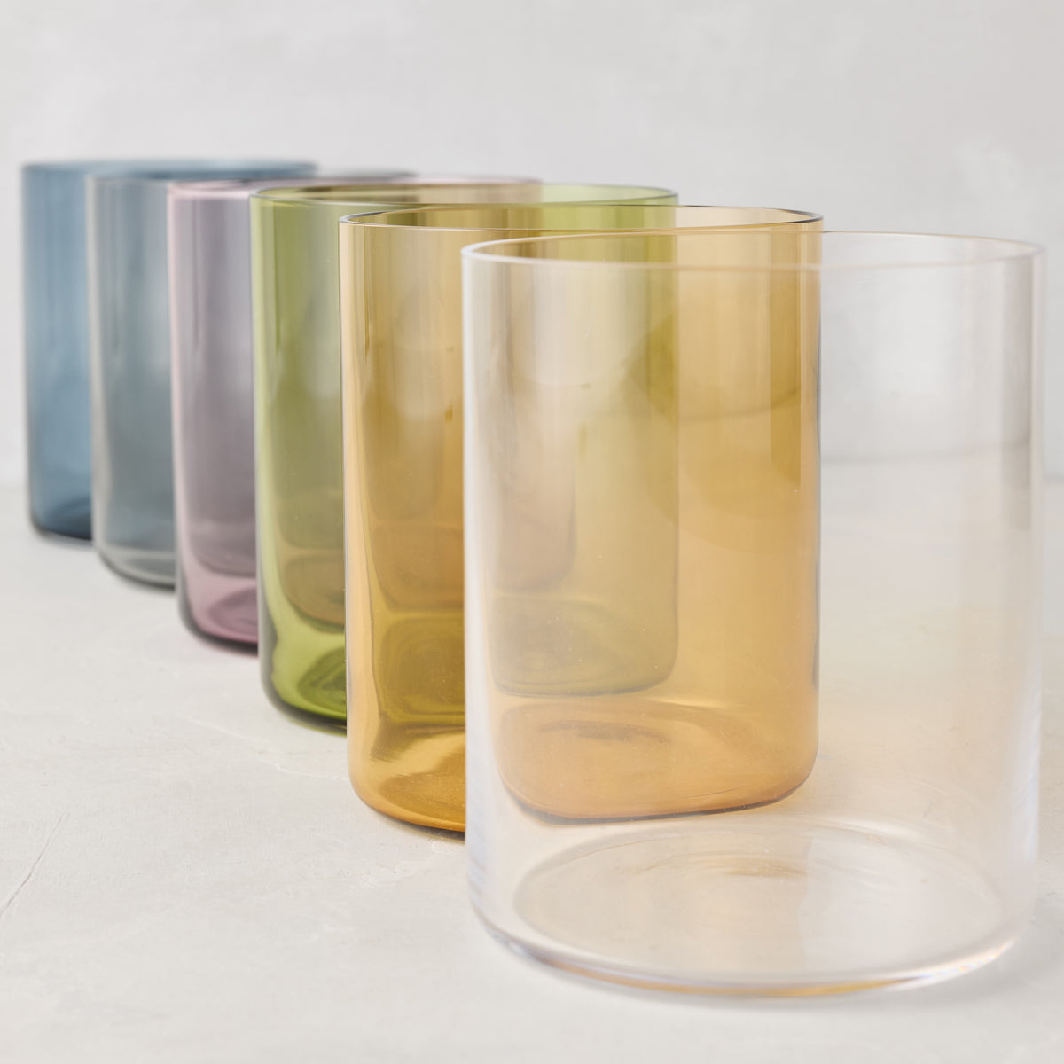 Hugo Smoke Grey Double Old Fashioned Glass, clear, amber, green, purple, and blue colored glasses.