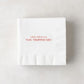 White paper cocktail napkin with "I didn't fall for you, YOU TRIPPED ME!" in red text.
