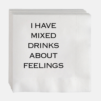 White paper cocktail napkins with "I HAVE MIXED DRINKS ABOUT FEELINGS" in black text.