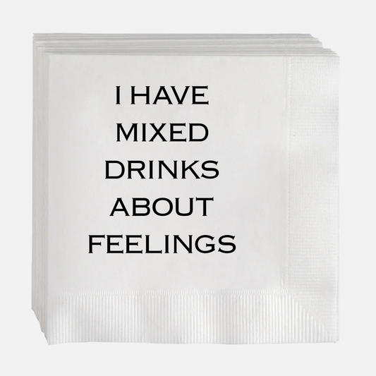 White paper cocktail napkins with "I HAVE MIXED DRINKS ABOUT FEELINGS" in black text.