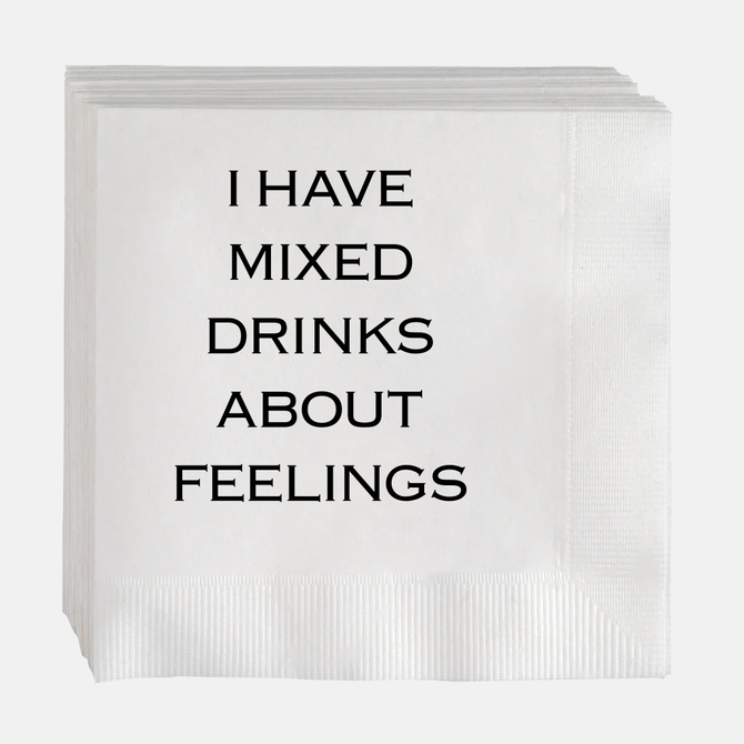 White paper cocktail napkins with "I HAVE MIXED DRINKS ABOUT FEELINGS" in black text.