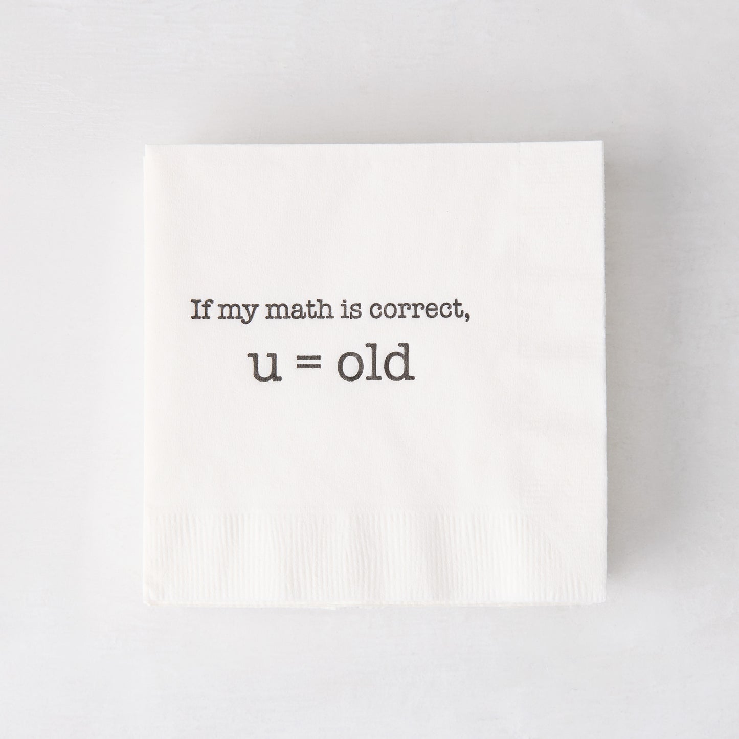 White paper cocktail napkin with "If my math is correct, u = old" in black text.