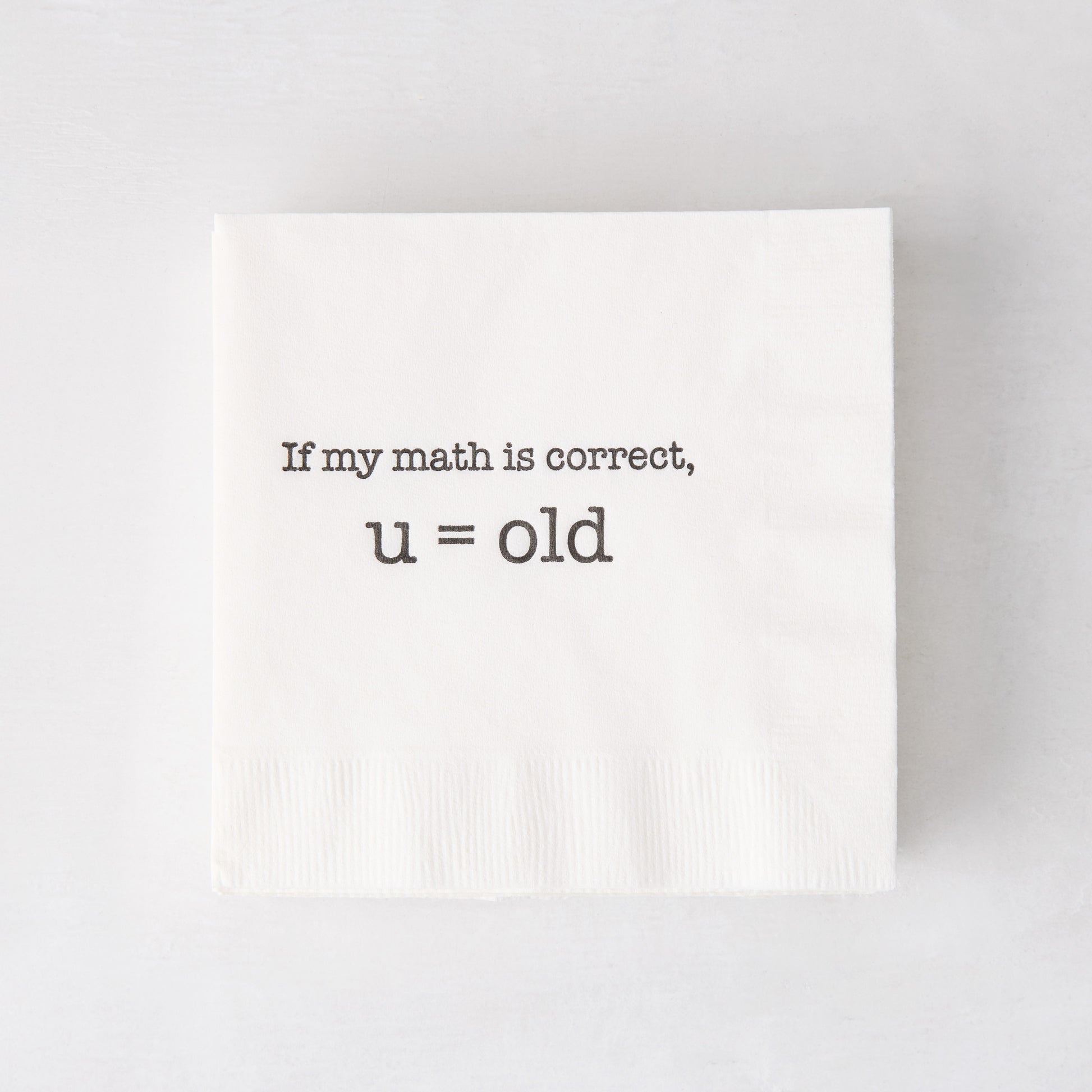 White paper cocktail napkin with "If my math is correct, u = old" in black text.