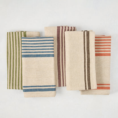 Five folded linen napkins with beige bases and vertical stripes in blue, green, plum, brown, and orange.