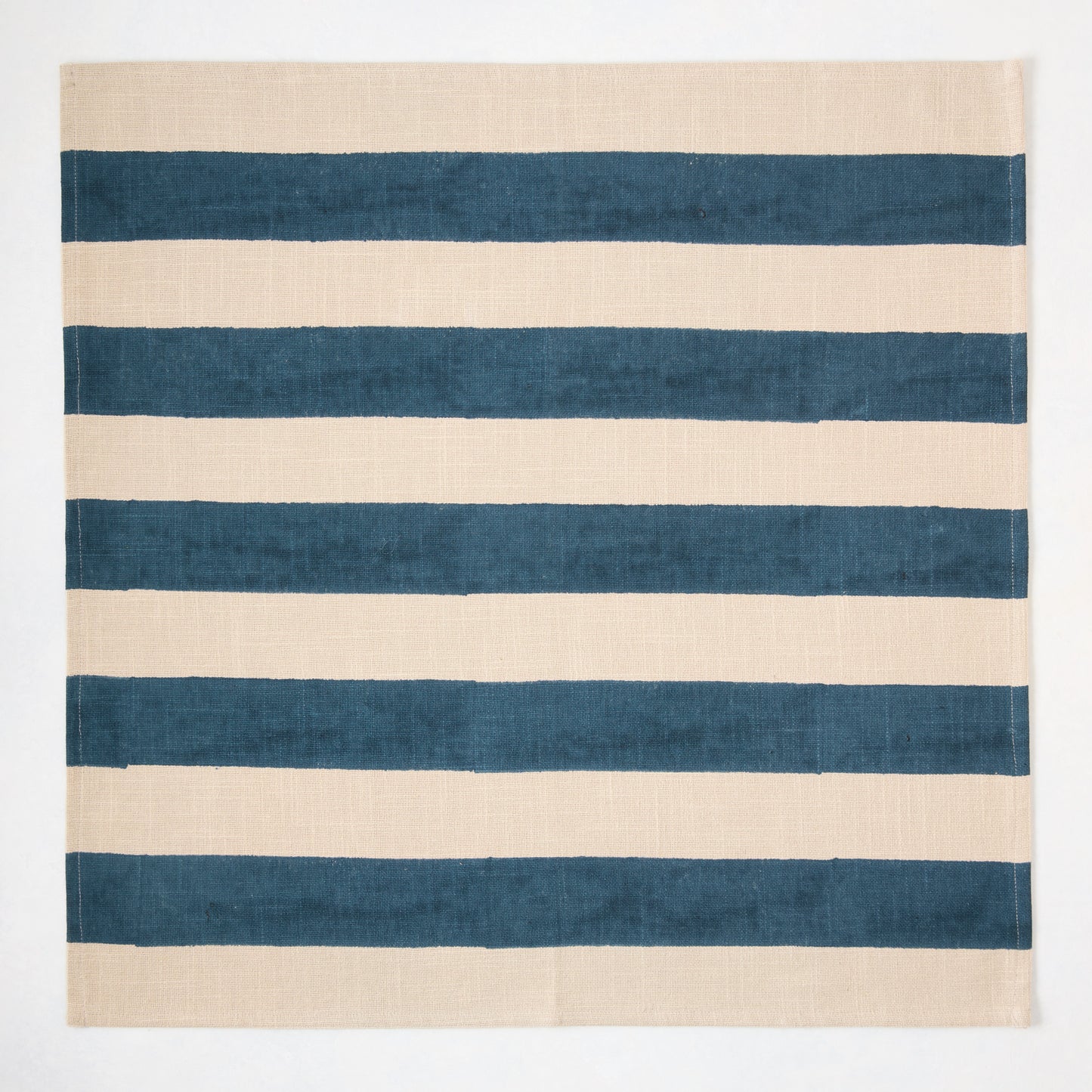 Indigo Blue Hampton Stripe Natural Cotton Napkin, 22" square, with wide blue stripes on a khaki base.