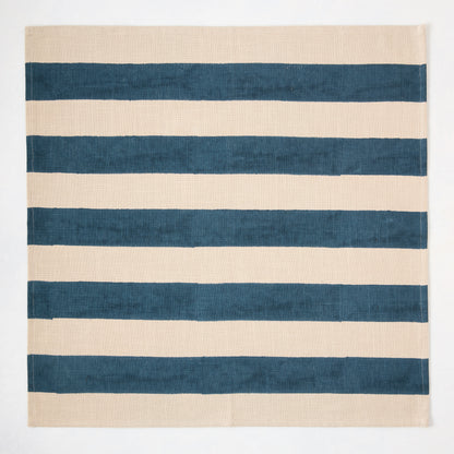 Indigo Blue Hampton Stripe Natural Cotton Napkin, 22" square, with wide blue stripes on a khaki base.