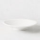 White individual ceramic pasta bowl, 10.75" diameter, shallow and wide, with a subtle footed base.