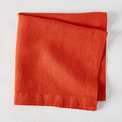 Folded International Orange HG Signature hand-dyed linen napkin, 22-inch square.