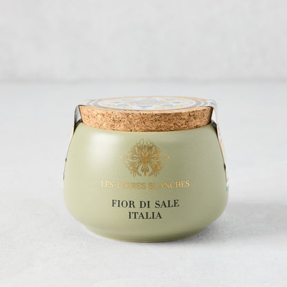 Italia Fleur De Sel salt in a green artisanal ceramic pot with a natural cork lid and gold text.