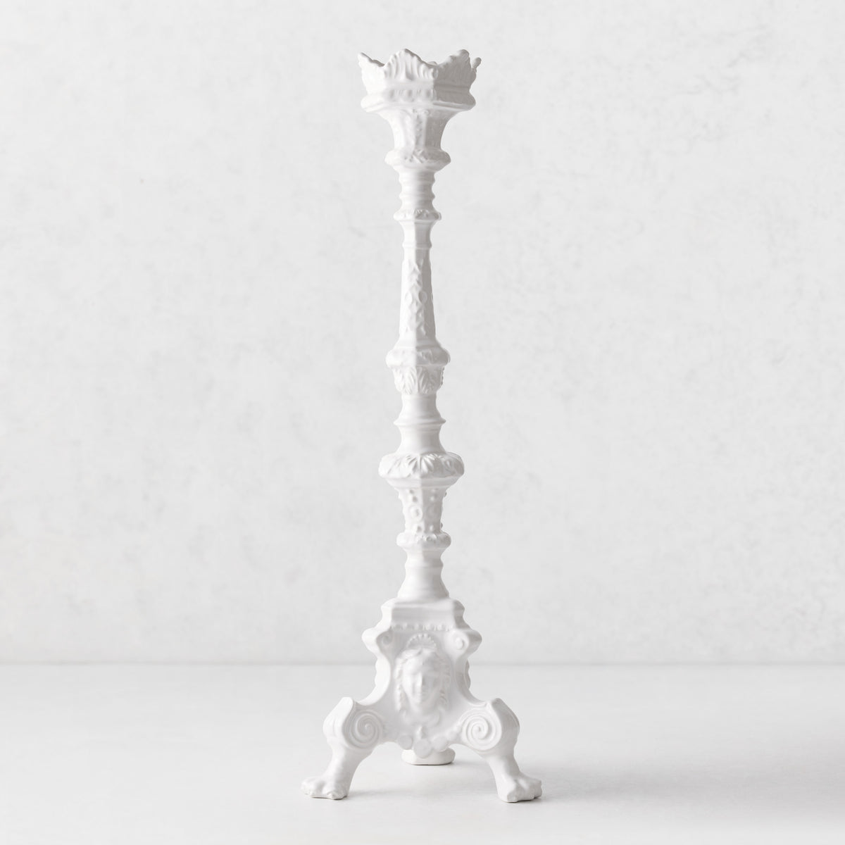20.5-inch tall white Italian ceramic footed candlestick with intricate antique-inspired detailing.
