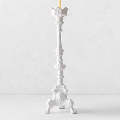 20.5-inch tall white ceramic footed candlestick with ornate antique-style detailing and a taper candle.