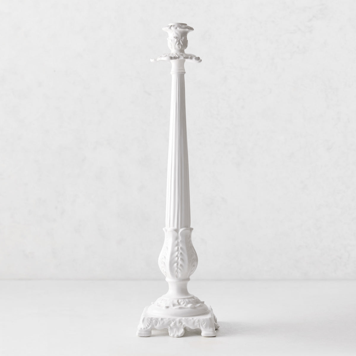Tall white Italian ceramic candlestick with intricate antique-style detailing and a tapered silhouette, 20.5 inches high.
