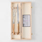 Jean Dubost Laguiole carving set with olive wood handles and stainless steel knife and fork in a wooden box.
