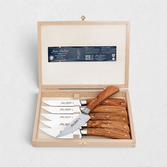 Jean Dubost Laguiole olive wood steak knives, set of 6, in a light wooden gift box.