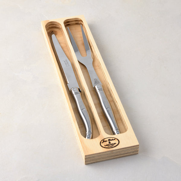 Jean Dubost Laguiole stainless steel 2-piece carving set, knife and fork, in a light wooden storage box.