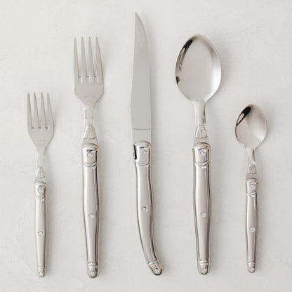 Jean Dubost Laguiole 5-piece stainless steel flatware set with iconic bee emblem.