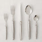 Jean Dubost Laguiole 5-piece stainless steel flatware set with iconic bee emblem.