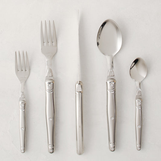 Jean Dubost Laguiole 5-piece stainless steel flatware set with iconic bee emblem.
