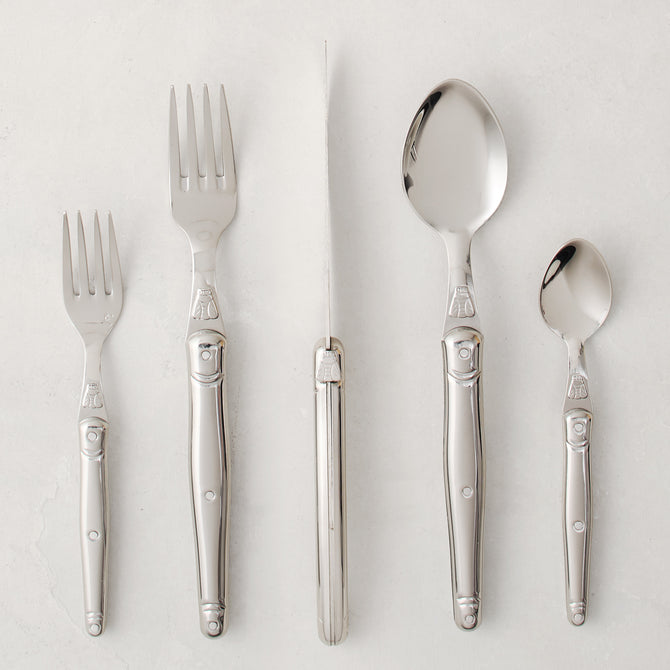 Jean Dubost Laguiole 5-piece stainless steel flatware set with iconic bee emblem.
