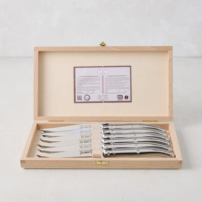 Jean Dubost Laguiole stainless steel table knives, set of 6, in an open wooden storage box with certificate.