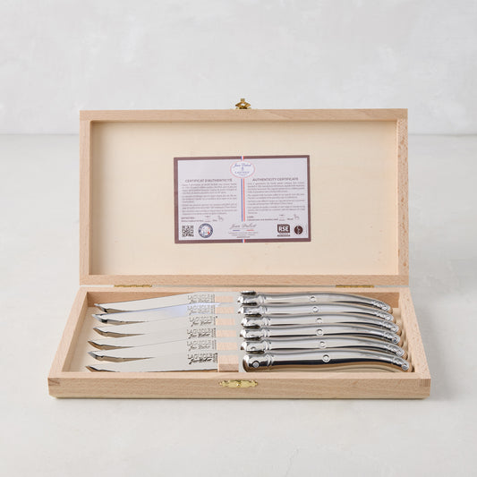 Jean Dubost Laguiole stainless steel table knives, set of 6, in an open wooden storage box with certificate.