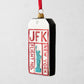 JFK Luggage Tag Christmas Tree Ornament, white, black, red, and blue glittered glass, 5.25"H.