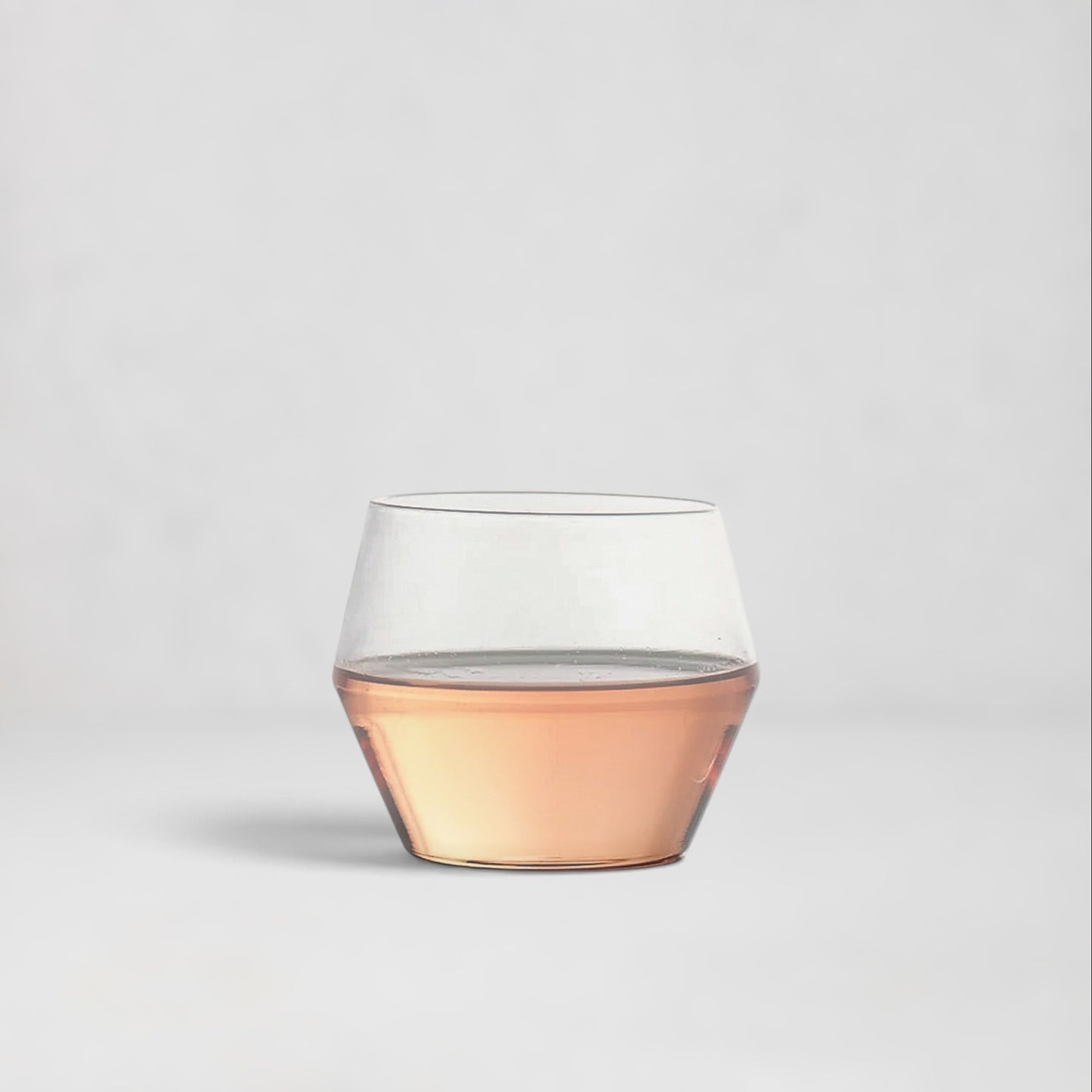 Hudson Grace Juniper double old fashioned glass with a sculptural geometric silhouette and rose-tinted base.