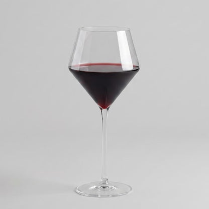 Modern Juniper red wine glass with a geometric bowl and thin stem, 17oz capacity, clear glass filled with red wine.
