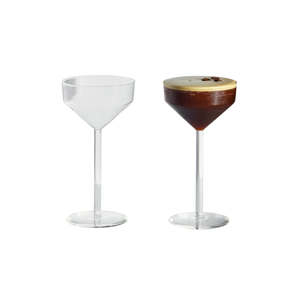 Set of two clear glass Juniper cocktail glasses with a modern geometric silhouette, one empty and one filled with espresso.