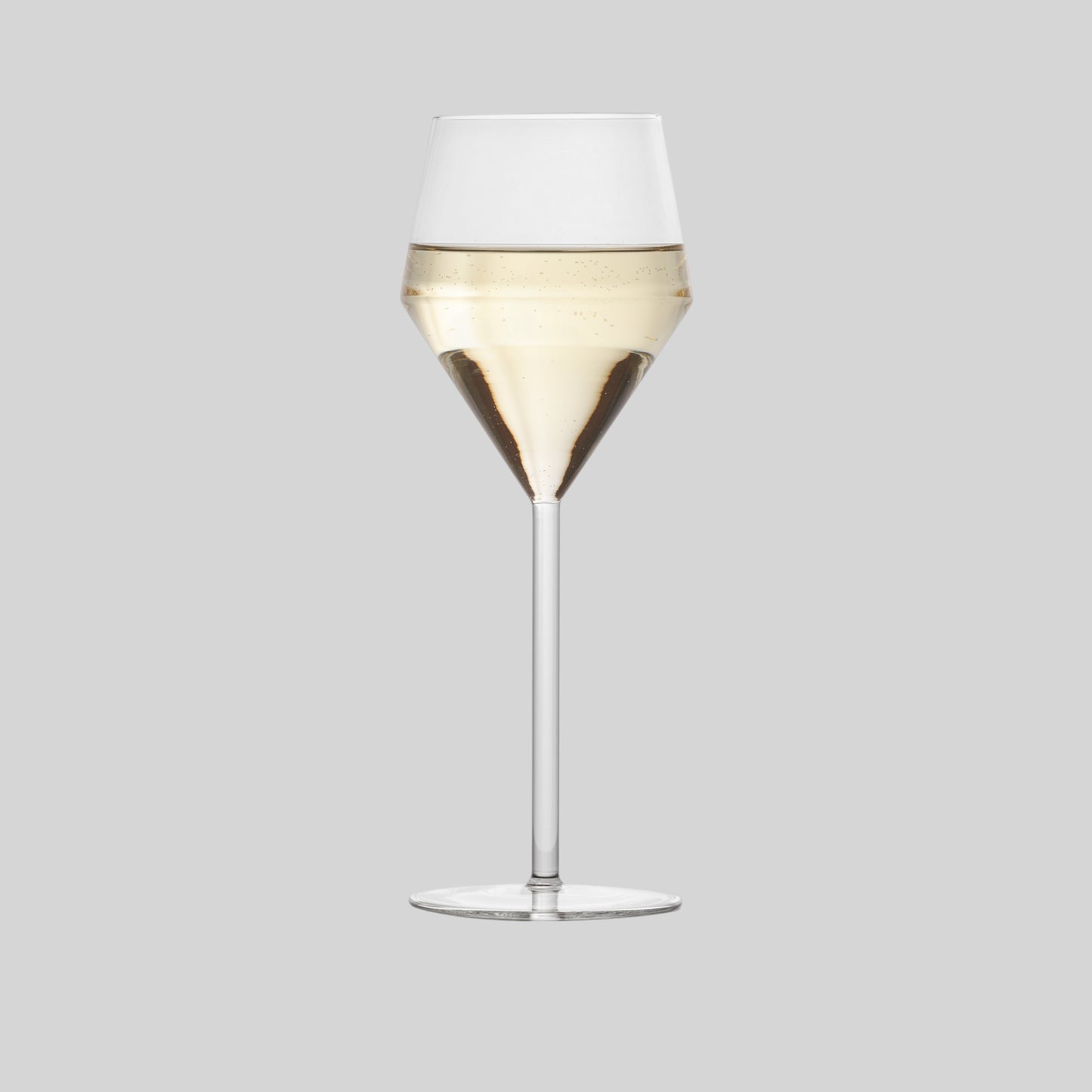 Hudson Grace Juniper white wine glass with a modern geometric silhouette and long thin stem, isolated on white.